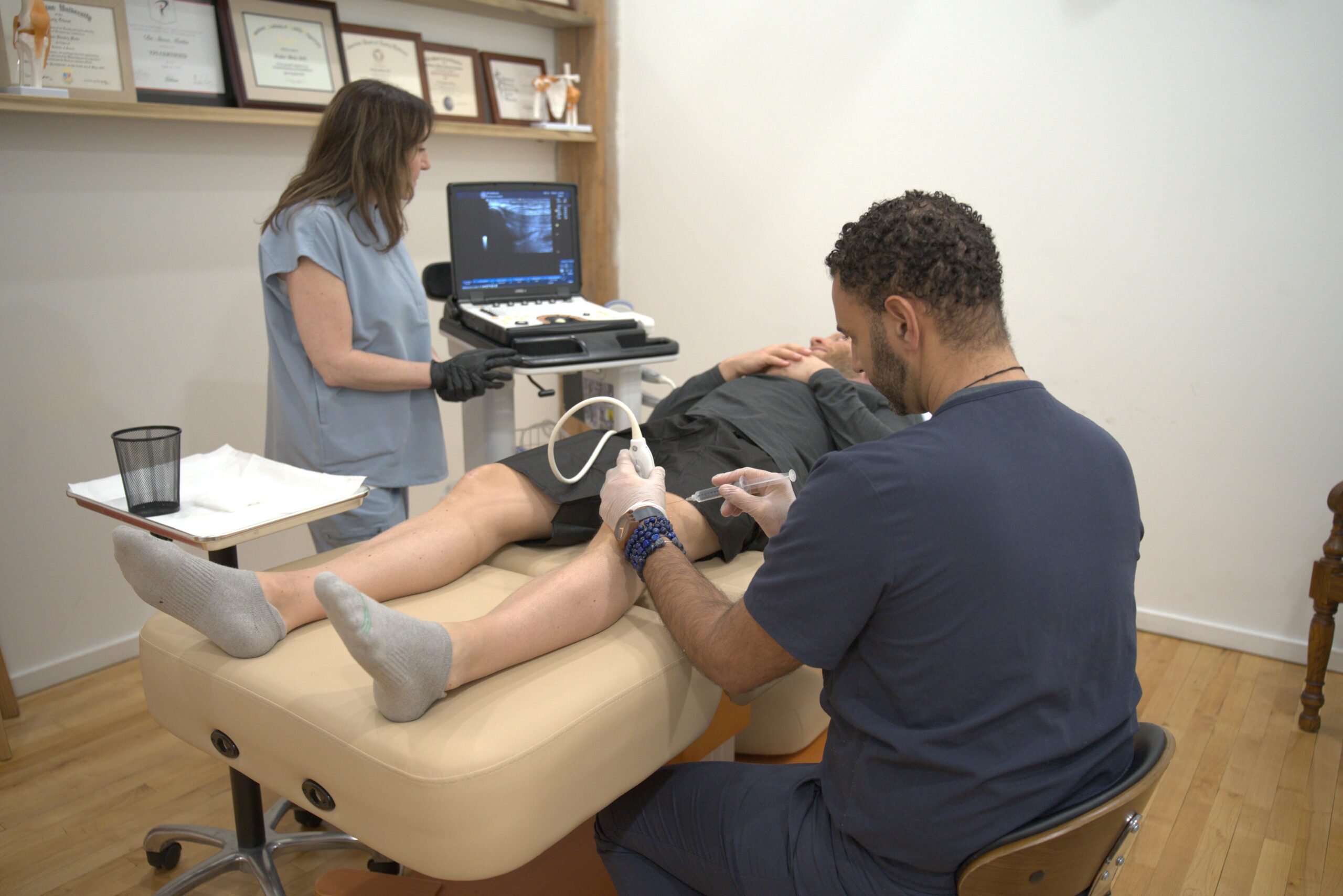 Dr. Matta performing an ultrasound guided injection to the knee.