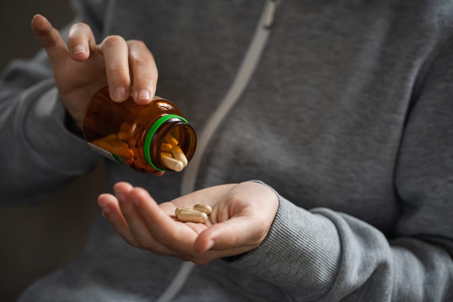 bottle-of-medical-pills-in-the-hands-of-a-person